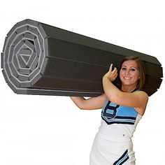 a woman is carrying a large object on her back