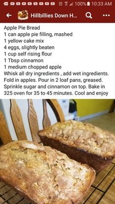 two loaves of bread sitting on top of a cooling rack