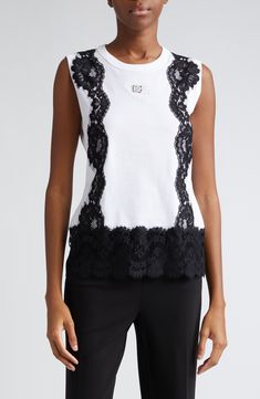 From the brand's DNA collection, this simple jersey T-shirt is eclectically elevated by black-lace detailing and a polished DG logo centering the chest. Crewneck Sleeveless 95% cotton, 5% nylon Dry clean Made in Italy Designer Clothing Elegant Cotton Lace Tank Top, Cotton Top With Contrast Lace For Summer, Black Sleeveless Top With Contrast Lace, Chic Cotton Tank Top With Lace Trim, Spring Cotton Tops With Contrast Lace, Chic Tops With Contrast Lace, Elegant Sleeveless Cotton Lace Top, Cotton Tops With Lace Trim And Crew Neck, Crew Neck Cotton Top With Lace Trim