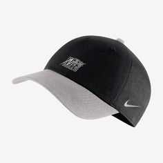 a black and white hat with the word nike on it