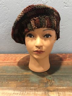 Hand crocheted multi-colored deep earth toned beret style hat. Lightweight acrylic yarn. Brown Bohemian Beanie One Size, Brown Yarn Hat, Brown Yarn Hat One Size, Brown Crochet Cap Hat, Knitted Yarn Beret One Size, Bohemian Brown Knitted Beanie, Brown Bohemian Crochet Cap, Brown Hand Knitted Yarn Hats, Brown Acrylic Yarn Hat For Fall