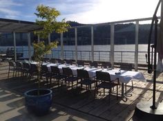 an outdoor dining area with tables and chairs