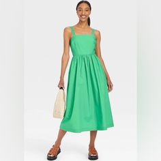 Women's Sleeveless Sundress In Green Sleeveless Summer Sundress For Spring, Sleeveless Spring Sundress For Summer, Spring Sleeveless Sundress For Summer, Sleeveless Summer Sundress Midi Dress, Sleeveless Sundress Midi Dress For Summer, Sleeveless Cotton Midi Dress For Vacation, Summer Sleeveless Cotton Mini Dress, Green Cotton Midi Length Sleeveless Dress, Green Cotton Midi-length Sleeveless Dress