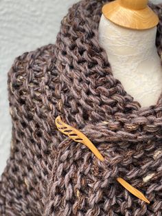 Hand knitted Outlander inspired shawl, scarf, shoulder wrap, neck warmer in marled brown with a hint of pale purple. - triangle design, can be worn in many different ways - one size fits all - made with 1 tassel, please let me know if you prefer 3 tassel (on each tip) or no tassels - super soft 50% acrylic, 30% wool, 20% mohair yarn - available in any color or yarn imaginable, please contact me for custom orders - made in smoke and pet free environment CARE: Hand wash , air dry. Brown Hand Knitted One Size Knitting Pattern, One Size Hand Knitted Brown Knitting Pattern, One Size Brown Hand Knitted Pattern, Cozy Brown Shawl One Size, Cozy One-size Brown Shawl, Cozy Knitted Shawl, One Size, Cozy Knitted Shawl For Fall, Cozy Knitted Shawl One Size, Brown Knitted Winter Shawl