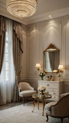 an elegant bedroom with chandelier, chair and mirror