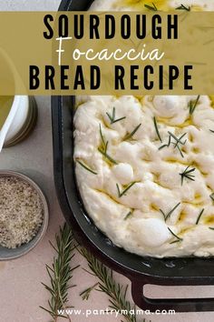 the bread is prepared and ready to be baked in the oven with rosemary sprigs