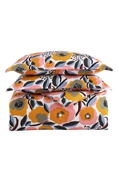 three pillow cases with flowers on them, one in orange and the other in pink