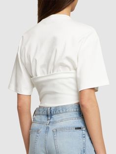 Corset structure at hem with front with lace-up closure. Model is wearing a sizeS White Cotton Cropped Hem Top, White Cropped Cotton Top, White Cotton Cropped Top, Fitted White Top With Cropped Hem, Fitted White Cropped Top, White Fitted Top With Cropped Hem, White Fitted Crop Top With Cropped Hem, Spring Cropped T-shirt, Fitted Cropped T-shirt For Spring