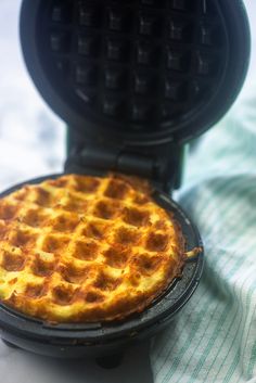 a waffle iron sitting on top of a table