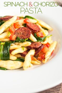 pasta with spinach and chorizo in a white bowl