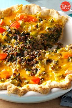 a quiche with meat and vegetables on a plate