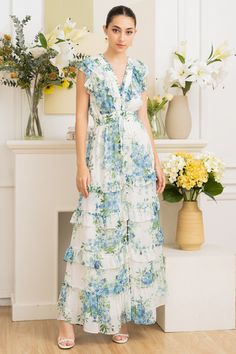 FINAL SALE. NO RETURNS. NO EXCHANGES. Cecile maxi floral dress has it all - a comfy elastic waistband, a ruffle v-neck, and a button-down design with charming ruffle skirt details. Get ready to make heads turn and feel absolutely fabulous in this must-have dress. LENGTH: 56" from top of shoulder STYLE#: DR-21063 in MAGIC BLOSSOM IVORY -S24 *Dry clean or wash on cold, and hang flat to dry.*Model is wearing a size XS Floor-length Ruffled Dresses For Daywear, Floor-length Ruffle Dresses For Daywear, V-neck Ruffled Maxi Dress For Daywear, Maxi Floral Dress, Dancesport Dresses, Neoprene Dress, Quinceñera Dresses, Skirt Details, Yumi Kim