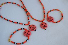 This fun and unique Halloween necklace, choker, bracelet or set makes a great addition to any Halloween costume. They are very nice and well made so you can wear them out or to the office to show that you are in the Halloween spirit. This jewelry set will also make a wonderful gift or party favor for Halloween. Standard length is listed and the bracelets, chokers and necklaces are made with stretchy beading cord so it can fit a larger wrist or neck. I can also add a chain extension if you need m Necklaces Choker, Pumpkin Bead, Beaded Jewelry Necklaces, Beading Cord, Halloween Necklace, Halloween Pins, Orange Pumpkin, Unique Halloween, Halloween Spirit