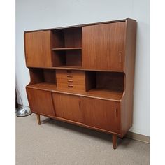 a large wooden cabinet with drawers on it