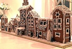 a large gingerbread house is decorated with icing