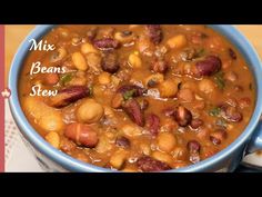 a blue bowl filled with beans and other food