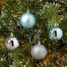 christmas ornaments hanging from the branches of a tree