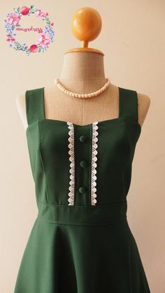 "*DHL shipping upgrade is available at check out process. Shipping part by DHL will take 3-6 days only. Production time may take around 2-3 weeks. If this is in rush you can convo us to make it sooner.:) Green vintage party dress. ✄ ITEM DESCRIPTION ✄ ● Simply classy and modest with touch of vintage style dress. ● Shoulder strap. ● Sweet heart bust line , button lined down. ● Swing circle skirt./ fully lined ● Back elastic make perfect fit to all body type. ● Full gather skirt. ● The fabric is o Retro Square Neck Dresses, Vintage Dress For Retro-themed Spring Events, Spring Vintage Dress For Retro-themed Events, Retro Party Midi Dress With Fitted Bodice, 1950s Style Sleeveless Dress For Retro-themed Events, Retro Sleeveless Dress With Fitted Bodice, Retro Midi Length Mini Dress For Party, Retro Mini Dress For Party, Retro Party Mini Dress