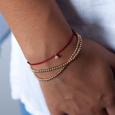 Our gold bead bracelets are available in 14K gold and rose gold. Handcrafted using perfectly round 2.5mm gold beads strung together on an elastic band, this dainty minimalist bracelet is easy to put on and remove. It's the perfect stacking bracelet but looks just as lovely all on its own. Available in three sizes, you're sure to find the perfect fit! Details: 2.5mm round beads Elastic closure The additional diamond charm bracelet shown in the photo can be purchased here: https://www.etsy.com/lis Rose Gold Beaded Bracelet, Gold Beaded Bracelets, Dainty Accessories, Gold Bead Bracelet, Silk Bracelet, Red String Bracelet, Stacking Bracelets, Rose Gold Beads, Jewelry Details