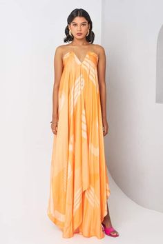 Orange dress with abstract printed patterns in a asymmetric draped silhouette. - Aza Fashions Chic Flowy Midi Dress With Abstract Print, Summer Silk Draped Maxi Dress, Pre-draped Asymmetrical Summer Dress, Spring Draped Maxi Dress In Viscose, Asymmetrical Silk Maxi Dress For Summer, Summer Asymmetrical Silk Maxi Dress, Pre-draped Midi Dress With Asymmetrical Hem For Summer, Flowy Pre-draped Summer Dresses, Summer Maxi Length Pre-draped Dress