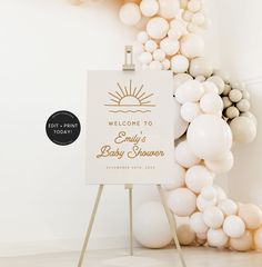 a welcome sign is surrounded by balloons in white and gold colors with the words, welcome to baby shower written on it