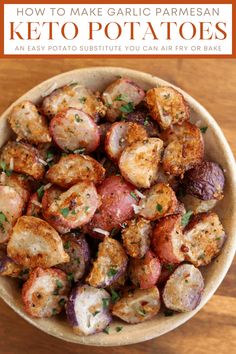 a bowl filled with cooked potatoes on top of a wooden table