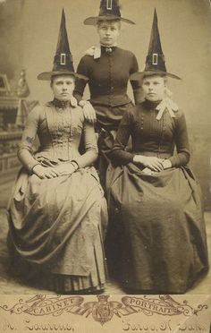 an old photo of three women wearing witches hats