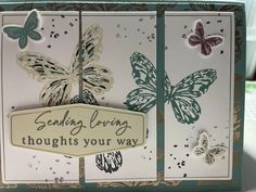 a close up of a greeting card with butterflies on the front and back of it