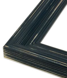 a stack of black and gold striped wood frames on a white background with clippings for text