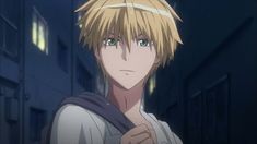 an anime character with blonde hair and green eyes