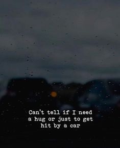 rain drops on the window and cars in the background with a quote written below it