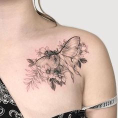 a woman with a butterfly tattoo on her chest