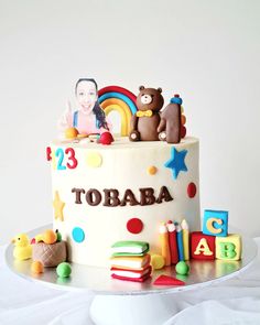 there is a birthday cake with toys on it