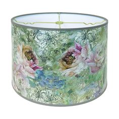 a lamp shade with flowers painted on it