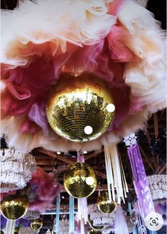 disco balls and chandeliers hanging from the ceiling