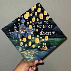 someone is holding up a graduation cap that says on to my next dream