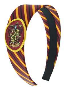 a harry potter striped headband with a hogwart crest on it