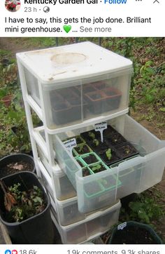 a stack of plastic containers filled with plants