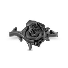 Glistening with mystique, this black diamond rose ring from the Enchanted Disney Fine Jewelry Villains Collection inspired by Maleficent indulges your dramatic side. Crafted in sterling silver with black rhodium plate This design showcases a sandblast-textured bloom set between bypassing thorny vines. Alluring black diamonds adorn the centerpiece while crown insets lower down the shank complete the look. This choice shines with 1/10 ct. t.w. of diamonds. ©Disney Disney Engagement Rings, Disney Rings, Disney Engagement, Nature Engagement Ring, Enchanted Disney, Enchanted Disney Fine Jewelry, Disney Fine Jewelry, Wedding Ring Necklaces, Nature Inspired Rings