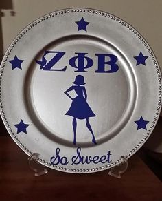 a white and blue plate with an image of a woman on it