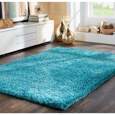 a bright blue rug in a living room