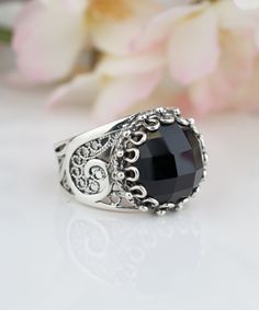 925 Sterling Silver Genuine Black Onyx Handmade Artisan Crafted Filigree Round Ring Material: 925 Solid Sterling Silver Genuine Natural Black Onyx Gemstone Dimensions : 12 mm, Round, Faceted Ring Face Length: 0.60 inches Width: 0.60, Round Comes with a gift pouch and box Free Domestic Shipping For this particular ring if desired We can change the stone to your favorite gem stone at a reasonable cost that is if the stone is not among what we are offering. Our fine silver jewelry is Made in our ex Black Jewelry With Stone Setting For Gift, Victorian Black Sterling Silver Rings, Victorian Style Black Sterling Silver Rings, Onyx Silver Ring, Faceted Ring, Fine Silver Jewelry, Onyx Gemstone, Round Rings, Gift Pouch