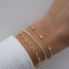 Beautiful chain bracelet that is sure to attract lots of admirers! Great for stacking or for a minimalist look! THICK, durable plating of 14k Gold or Rhodium over brass – for a piece that will be with you for years to come! Nickel-free & Hypoallergenic Available in 6.25”, 6.75”, or 7" + .5" Ext Lobster Clasp Closure Width: 4.5mm Bracelets on Model: Pave Bracelet, Cuban Link Bracelet Classy Jewelry Bracelets, Dainty Gold Sterling Silver Bracelet For Everyday, Dainty Delicate Chain Bracelets For Layering, Minimalist Tarnish-resistant Bangle Charm Bracelet, Sterling Silver Bangle With Adjustable Chain For Everyday, Gold Link Sterling Silver Bracelet In Minimalist Style, Everyday Stackable Gold Plated Chain Bracelet, Gold Sterling Silver Link Bracelet Minimalist Style, Everyday Sterling Silver Adjustable Bangle Bracelet