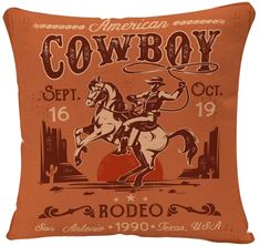 an orange pillow with a cowboy on it