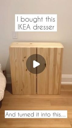 a wooden cabinet sitting on top of a hard wood floor next to a white wall