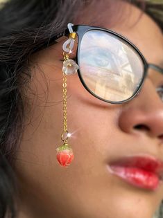 Adorable strawberry glasses charm made with gold tone chain, beautiful resin strawberry, and tiny white flower. This chain has a silicone loop to quickly attach on any pair of glasses for a cute and unique addition to your outfit!  Chain is approximately 2 inches long Check out the rest of my store for many more unique glasses chains and jewelry! Cheap Elegant Metal Glasses Chains, Cheap Trendy Plastic Glasses Chains, Cheap Multicolor Glasses Chains As Gift, Strawberry Glasses, Chains Aesthetic, Diy Glasses, Unique Glasses, Glasses Strap, Strawberry Flower