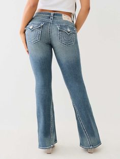 Give your wardrobe a sexy upgrade with the Joey Low Rise Super T Flare Jean. This women’s jean features a low-rise waist, zip fly, whiskering, and a twisted inseam. Finished with two-tone hardware, horseshoe detailing on the flap pockets, and Super T stitching.     Style: 208619 Kids Denim, True Religion Jeans, Plus Size Jeans, Short Shirts, Pant Shirt, Dark Wash Denim, Light Wash Denim, Jeans Flare, Sweater And Shorts