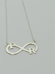 Color: silver Chain: .925 Silver Length: 18 inc (45 cm) Pendant size: 3.5 cm/1.6 cm Material: 925 Sterling Silver Weight:3.50 grams 925 sterling silver , infinity latter silver necklace loved necklace. İt can be to letters Two letters or numbers can be written on this infinite symbol necklace. It has a hard structure. It is resistant to breakage and you can use it for many years. The chain is 925 silver and very sturdy. Infinity Letter Necklace, Infinity Necklace, Personalized Infinity Initial N Elegant Silver Infinity Name Necklace, Silver Infinity Name Necklace, Silver Infinity Name Necklace For Anniversary, Infinity Name Necklace For Anniversary, Personalized Infinity Jewelry In White Gold, Personalized Infinity Necklace For Mom, Personalized Infinity White Gold Jewelry, Personalized White Gold Infinity Jewelry, Silver Infinity Name Necklace In Sterling Silver