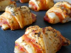 several pieces of bread wrapped in cheese and pepperoni