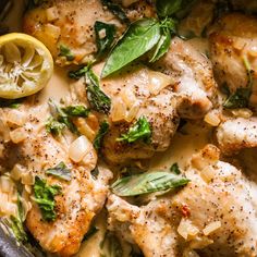 chicken with spinach and lemon in a skillet